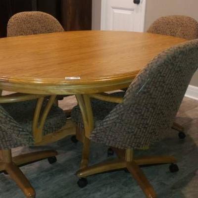 Wood Table with 6 Upholstered Rolling Chairs
