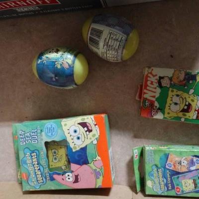 lot of spongebob playing cards and candy