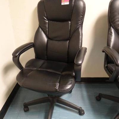 Black faux leather rolling and adjustable chair