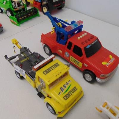 4 various tow trucks