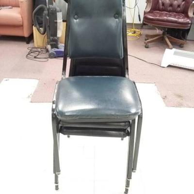 Three Black Upholstered Metal Chairs
