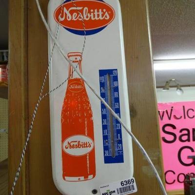 Neslitts metal thermometer.
