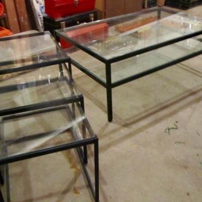 Two tier glass top table with three nesting end table