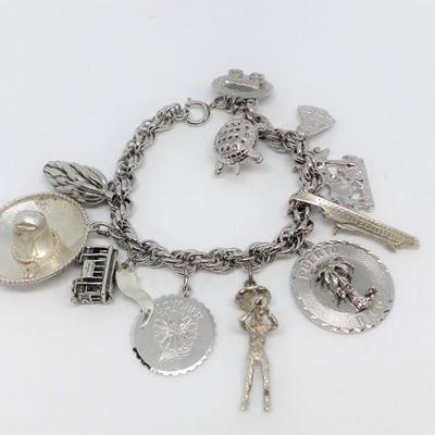 LOT 22 VINTAGE STERLING SILVER CHARM BRACELET WITH 11 CHARMS