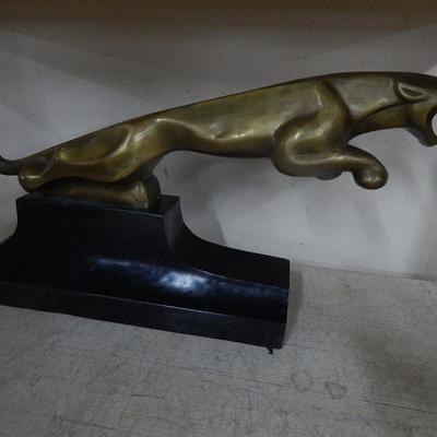 Brass cougar statue on base