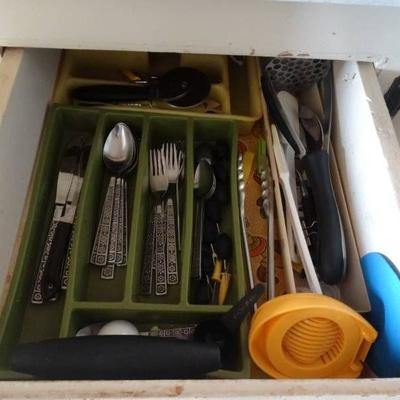 Drawers with silverwear, ziploc bags, aluminum foi ...