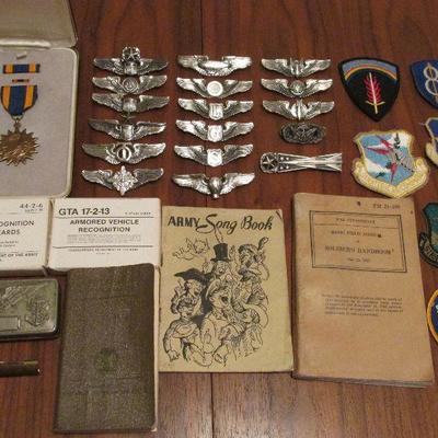 Many military pins, patches and manuals