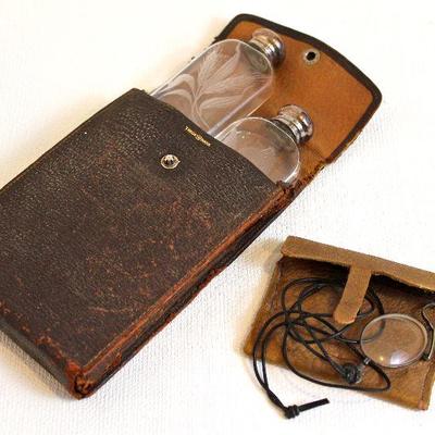 twin etched glass flasks in leather case, pince nez in case