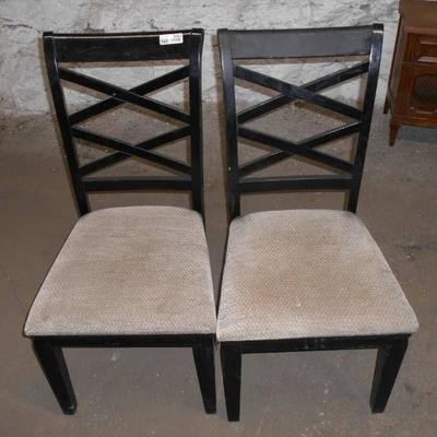 Two Black Chairs with Tan Upholstered Seats