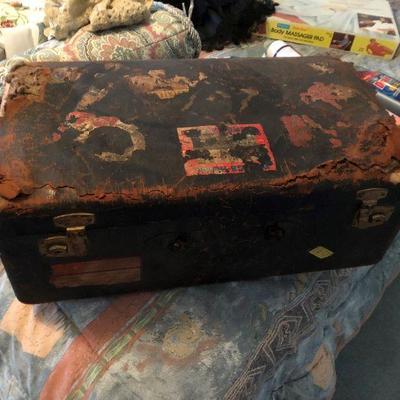 very old suitcase that has seen a lot