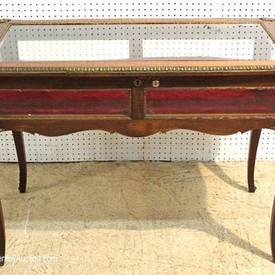  FANTASTIC PAIR of ANTIQUE French Display Glass Top Tables with all Applied Bronze Wrap

Located Inside â€“ Auction Estimate $400-$800 