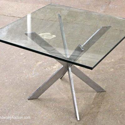  Modern Glass Top and Heavy Chrome Table by â€œTrimark Furnitureâ€

Located Inside â€“ Auction Estimate $100-$300 
