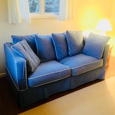 Crate + Barrel 70 inch sofa. Chambray blue with a full size pullout bed. Brand new condition.