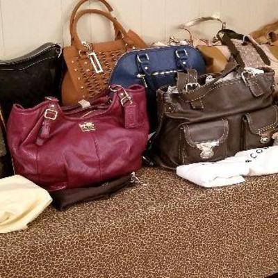 Table full of designer handbags - the good ones!
