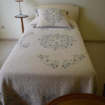 Twin Bed, Lamp Table, Art, Quilt