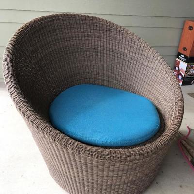 CRATE & BARREL round weather-proof wicker chair with wheels. Includes umbrella cushion. $150