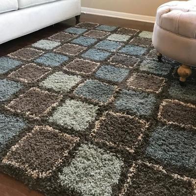 Area rug. 60" x 84". $58