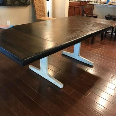 Dining table with two leaves. dark top with cream colored legs. $150