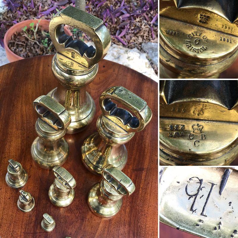 19th Century antique brass bell shaped weights from England. Marked with the "City of Bristol" stamp, and it has verification marks including a stylized crown over V.R. (Victoria Rex). This is a set of 9 weights, to include the hard-to-find 14 lb weight. Estate sale price for the set is $950.