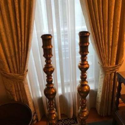 Large brass candlestick holders.
