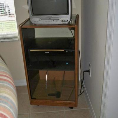 Small TV with DVD Player; Stereo Cabinet.
