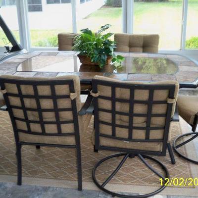 Metal / Stone Tile and Glass Top Table with 6 Chairs ( 2 of the chairs swivel and rock ).