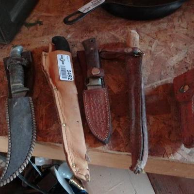 Lot of various knifes in sheaths.