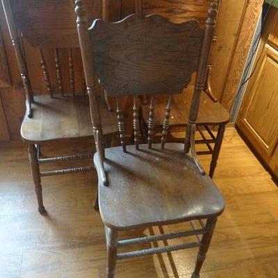 3 Wooden dining press back chairs.