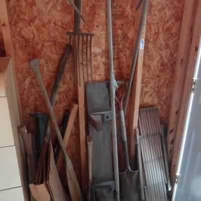 Lot of saws, racks, hand tools, etc.