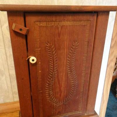 Vintage cabinet with 3 shelfs and one door.