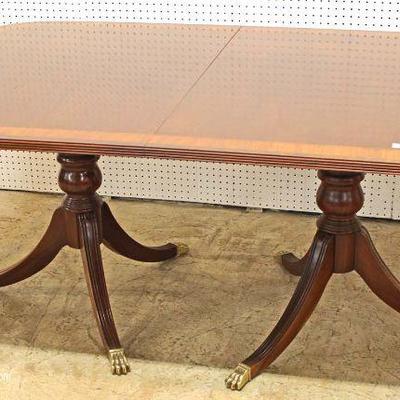  7 Piece Mahogany Banded and Inlaid Dining Room Table with 2 Leaves and 6 Carved Ball and Claw Dining Room Chairs in the Chippendale...