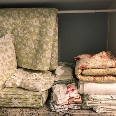 lots and lots of table, bed and bath linens, pillows, area rugs and window shades