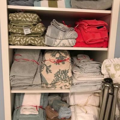 lots and lots of table, bed and bath linens, pillows, area rugs and window shades