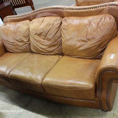 Contemporary 2 Piece Tan Leather Sofa and Club Chair– auction estimate $200-$400 