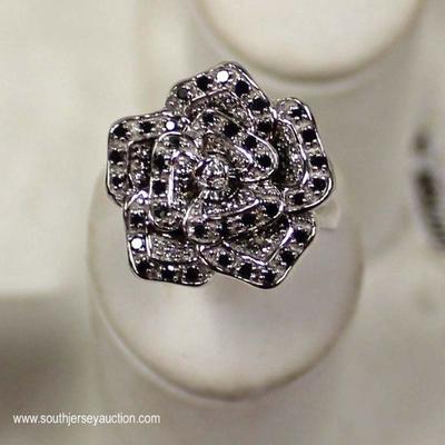  10 Karat White Gold Black and White Diamond Flower Ring â€“ auction estimate $200-$400 