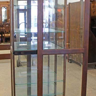 Contemporary Mahogany Display Cabinet by “Howard Miller” – auction estimate $100-$200 