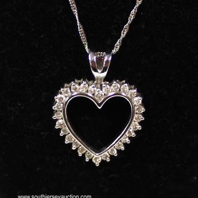  14 Karat White Gold 1 CTW Diamond Heart Pendant and Necklace â€“ auction estimate $500-$1000 