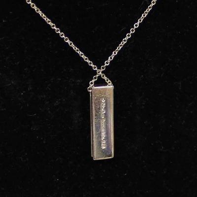 RARE Tiffany and Company Sterling Silver â€œXOâ€ Pendant with Diamond and Necklace â€“ auction estimate $200-$400 