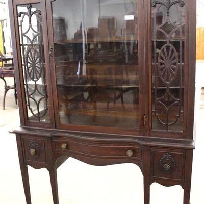 Walnut Carved China Cabinet up on Legs by “Penn House Furnishing Co.” – auction estimate $100-$300 