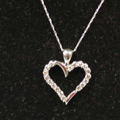  10 Karat White Gold Â½ CTW Diamond Heart Pendant and Necklace â€“ auction estimate $200-$500 