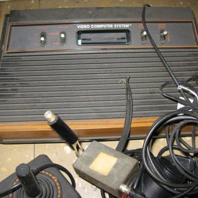Atari 2600 game system with joy sticks, paddles and games 