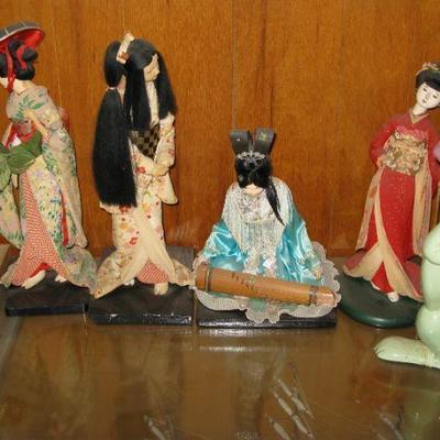collection of fabric oriental dolls