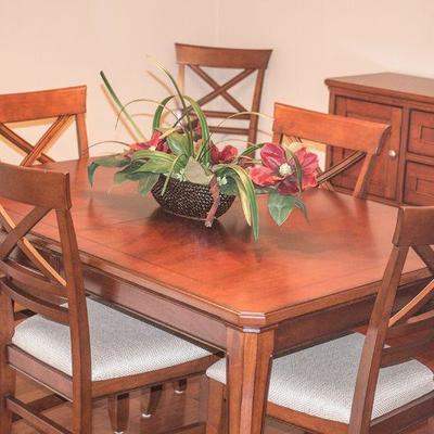 Dining table with six chairs and inlaid accent by Winners Only.