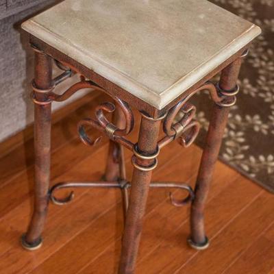 Metal-work accent table with faux leather-like top.