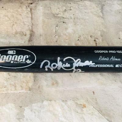 Roberto Alomar (HOF) game day black bat with his signature in silver sharpie. Estate sale price: $450