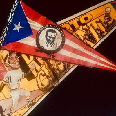 [back] 1994 Roberto Clemente pennant, with Puerto Rico flag and Pirates uniform. $35. [front] Roberto Clemente Puerto Rico pennant. $20