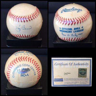 Signed and certified baseball by YOGI BERRA.  It also comes with an acrylic case.  Estate sale price: $350
