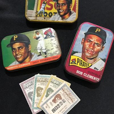 Collectible Roberto Clemente tin boxes. $5 each.  Roberto Clemente Pittsburgh Pirates Vintage 1975 Puerto Rico Lottery Ticket. $10 each.