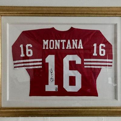 Framed Joe Montana signed football jersey. Estate sale price: $925