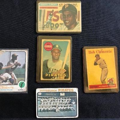 [Top] 1956 Topps Clemente @ $195. 
[Middle left] 1973 Topps Clemente @ $5.  
[Middle] 1969 Topps Clemente $19  
[Middle right] 1958 Topps...